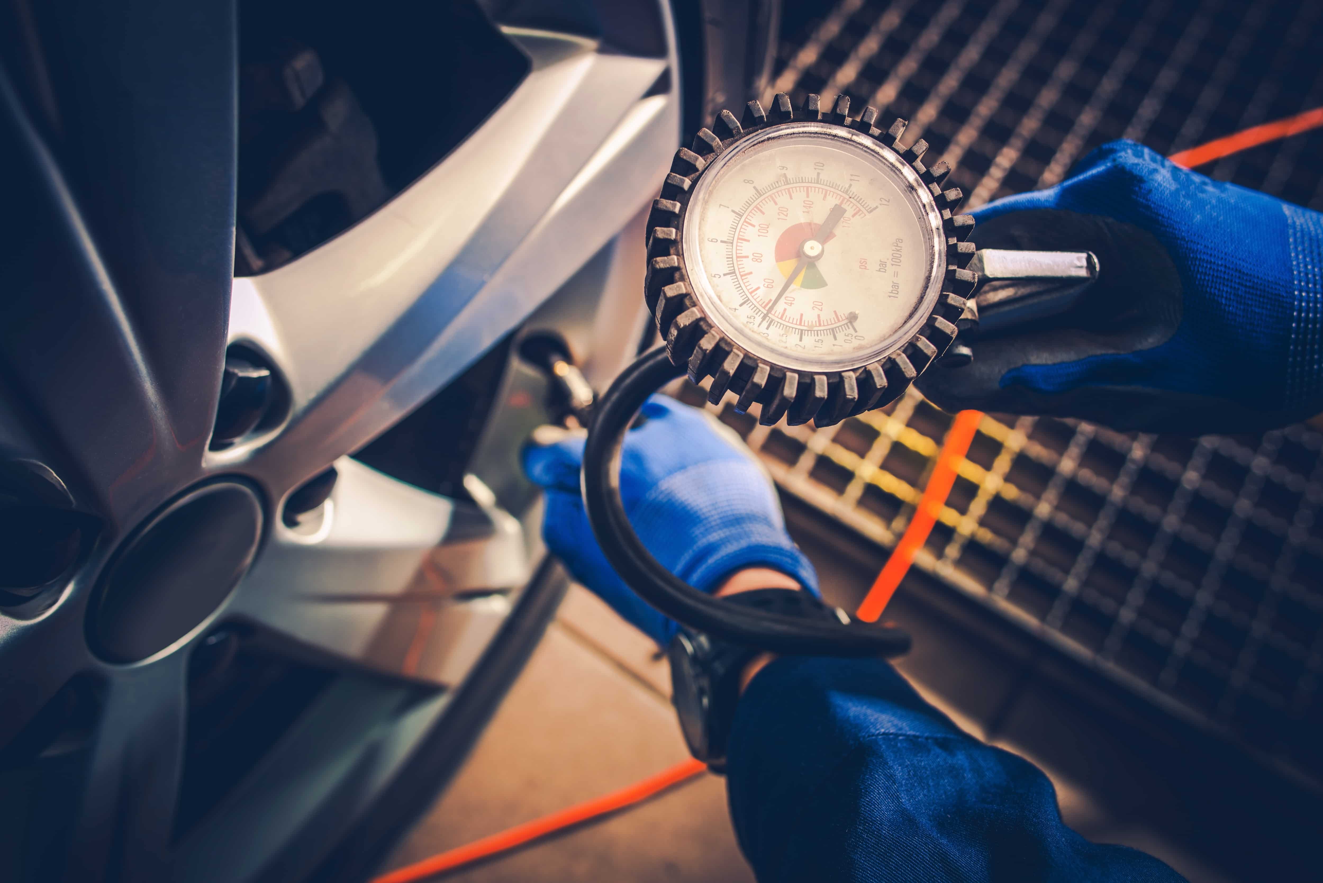Car Servicing & Repairs in Somerton | Beyana Automotive Professional tire pressure testing in Somerton - Mechanic using precision gauge for tire inspection and maintenance